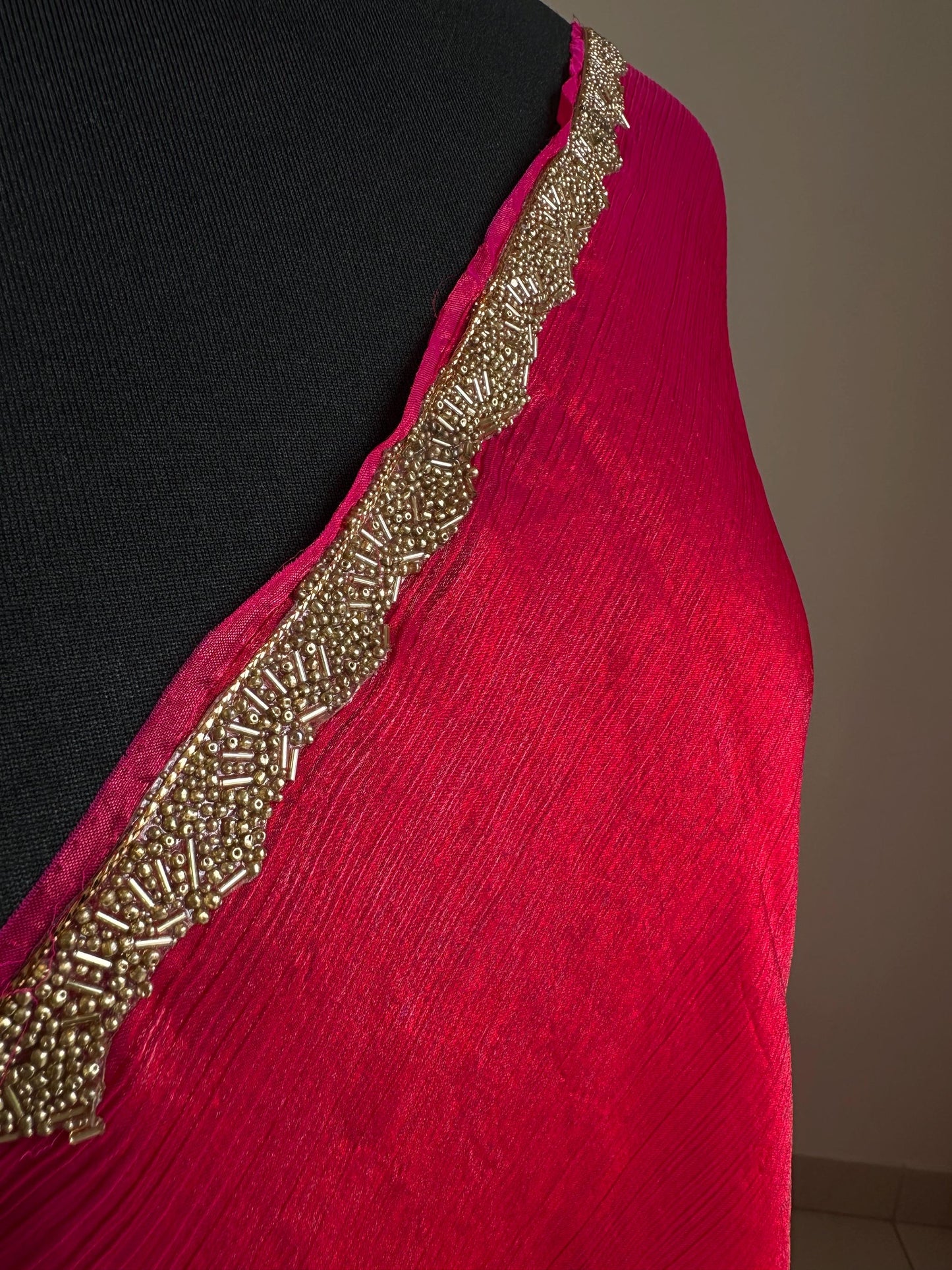 Deep pink chiffon saree with cutdana border. Crafted from soft shimmer chiffon this saree is perfect for parties and evening occasions