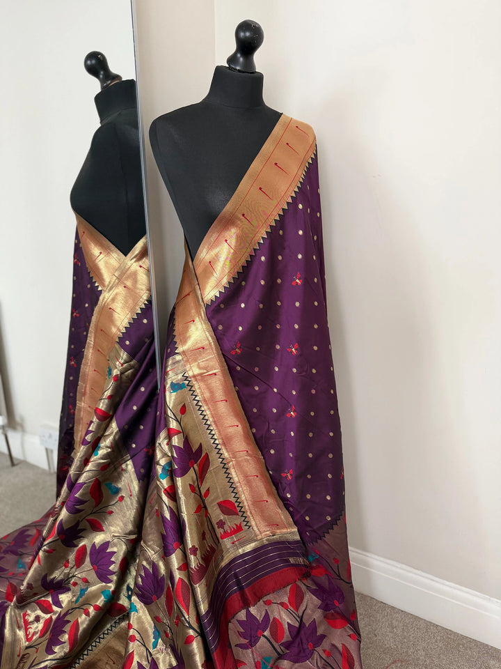 Purple paithani wedding saree. Intricately woven floral design semi silk saree with deep red blouse. LaiLai Sarees