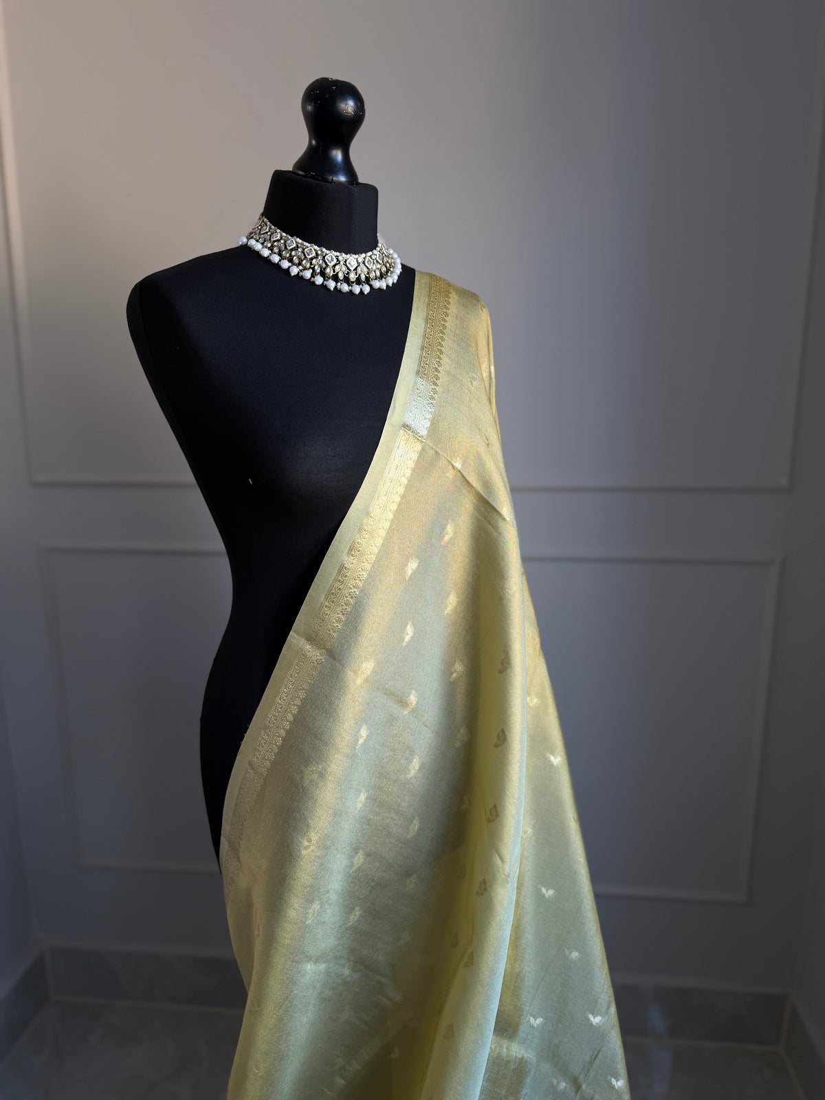 Golden ivory tissue silk saree with slim gold zari border