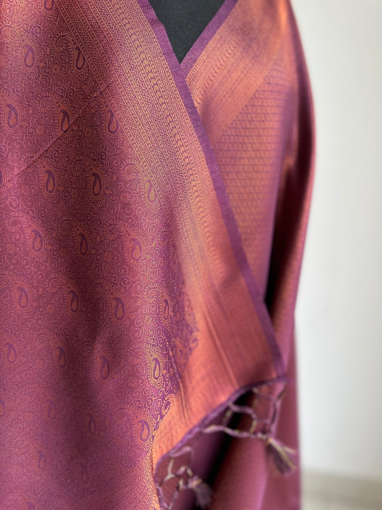 Wine burgundy soft silk saree with copper border and all over sheen. The perfect saree for parties all traditional events.Versatile saree