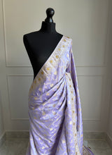 Elegant lilac Banarasi Saree with champagne gold Zari and cutdana work
