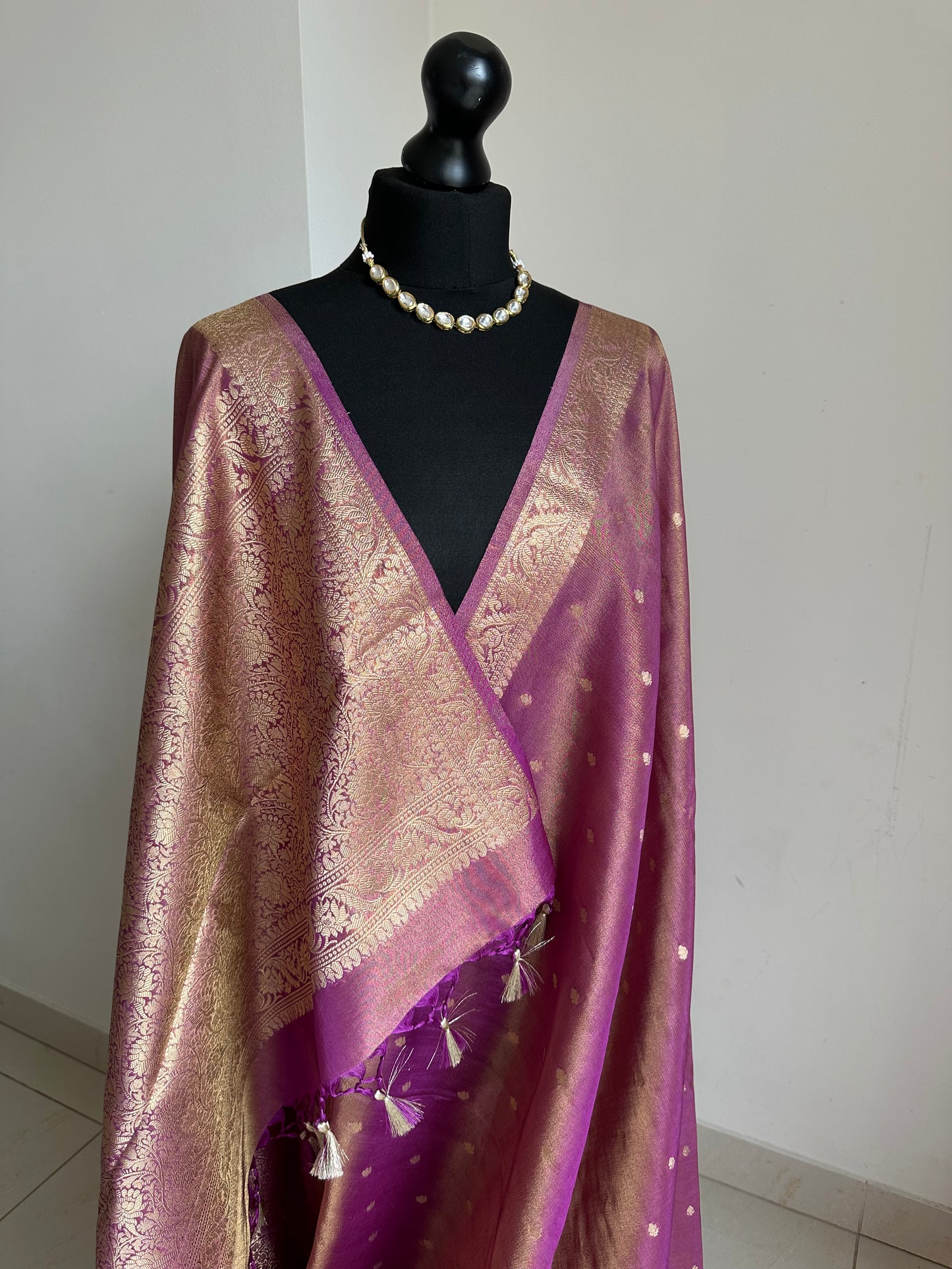 Dual tone magenta and gold semi tissue silk saree. Unstitched brocade blouse.