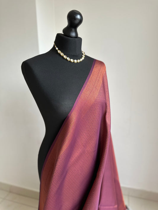 Wine burgundy soft silk saree with copper border and all over sheen. The perfect saree for parties all traditional events.Versatile saree