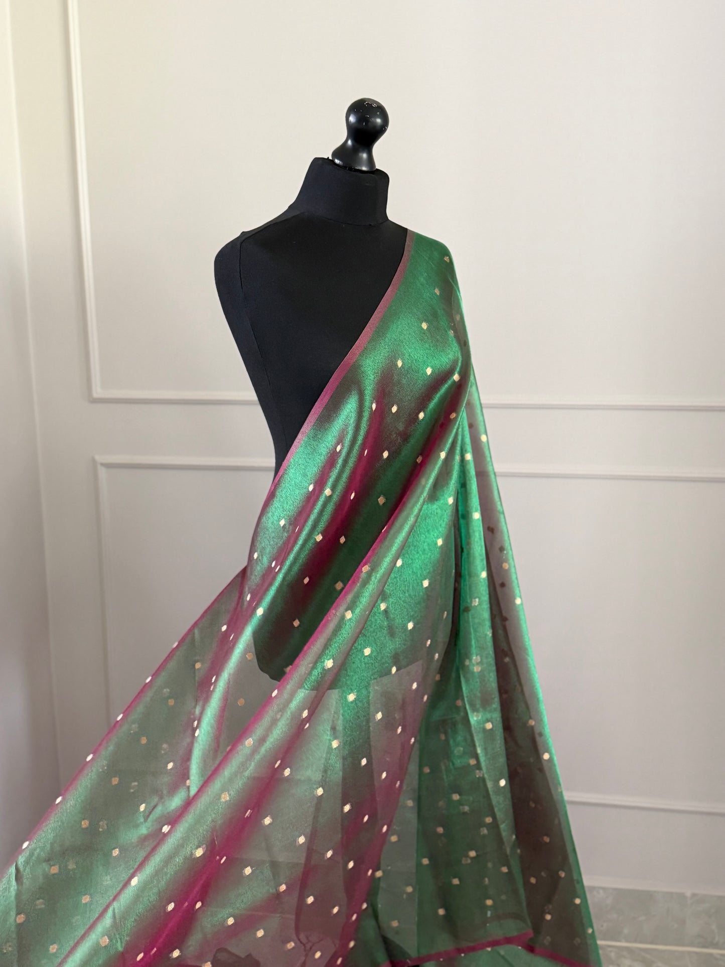 Statement handmade green and magenta dual tone soft tissue saree with unstitched blouse. Gold buti polka dot wedding saree. Unique saree look for events