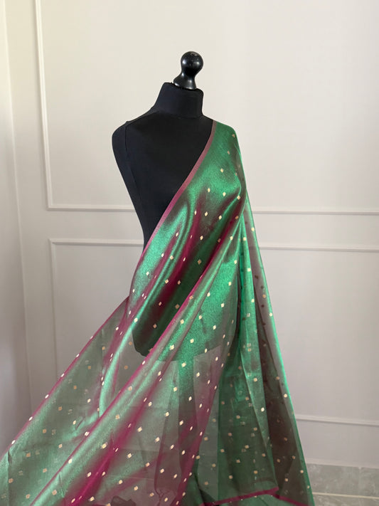 Statement handmade green and magenta dual tone soft tissue saree with unstitched blouse. Gold buti polka dot wedding saree. Unique saree look for events