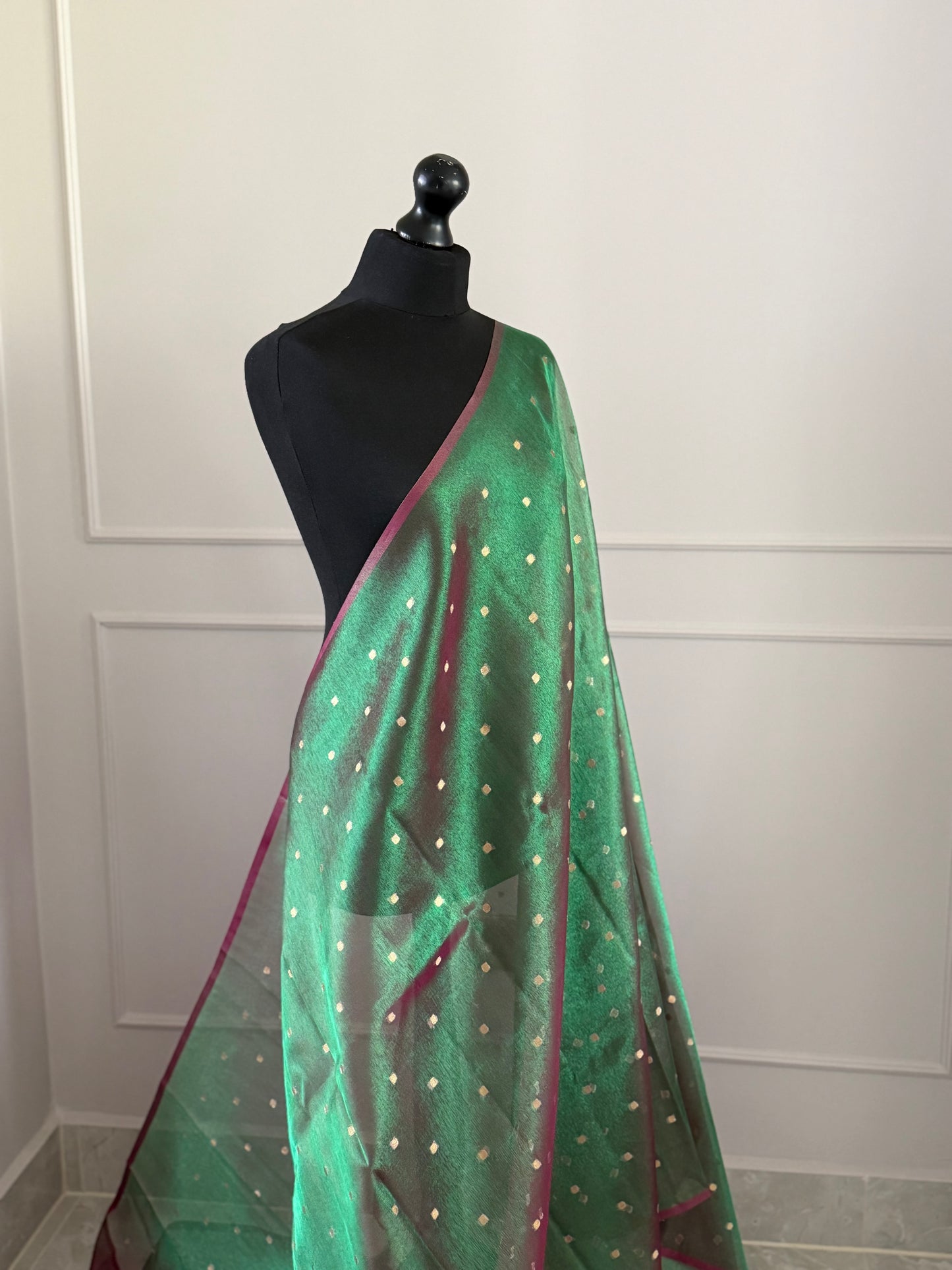 Statement handmade green and magenta dual tone soft tissue saree with unstitched blouse. Gold buti polka dot wedding saree. Unique saree look for events