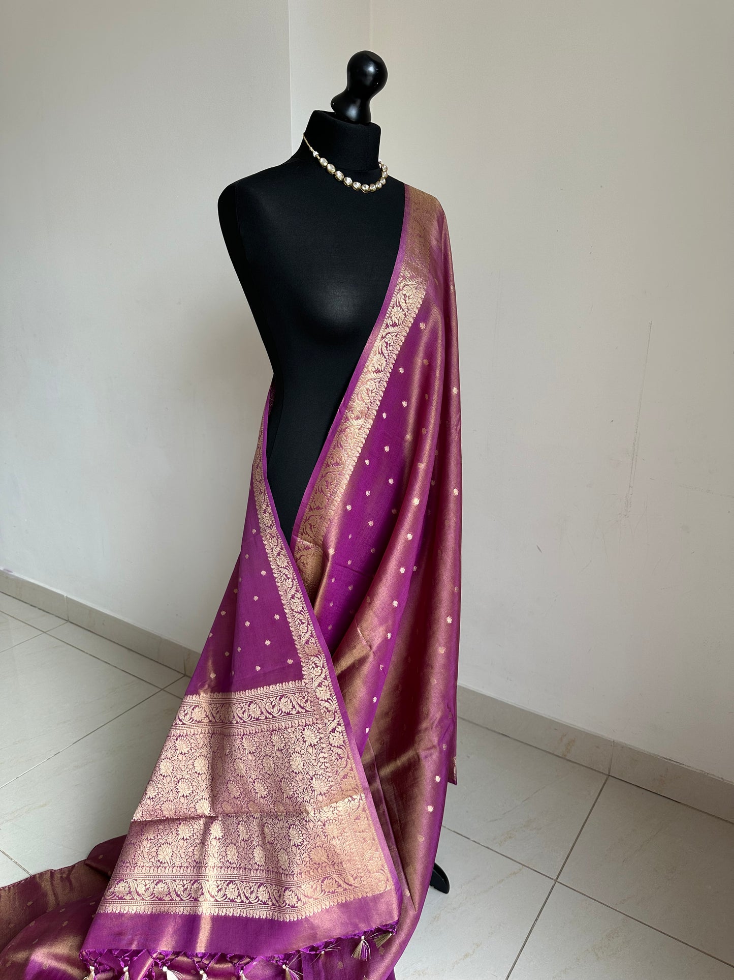 Dual tone magenta and gold semi tissue silk saree. Unstitched brocade blouse.