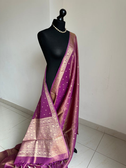 Dual tone magenta and gold semi tissue silk saree. Unstitched brocade blouse.