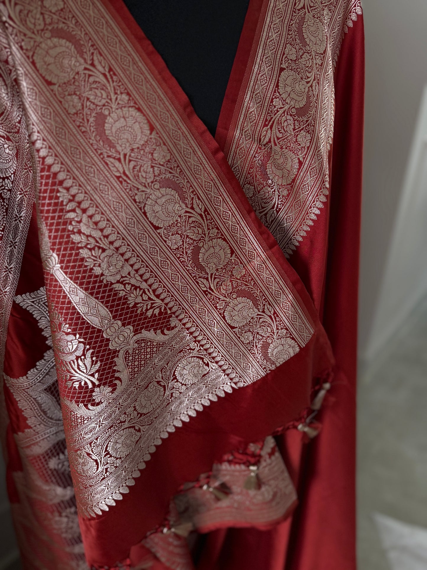 Banarasi silk crimson red mashru wedding saree with  gold zari. Red traditional silk saree with designer patterned blouse.
