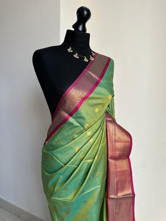 Green and pink colour saree with gold zari border and buti. Traditional semi silk saree beautiful colour and design. Designer saree