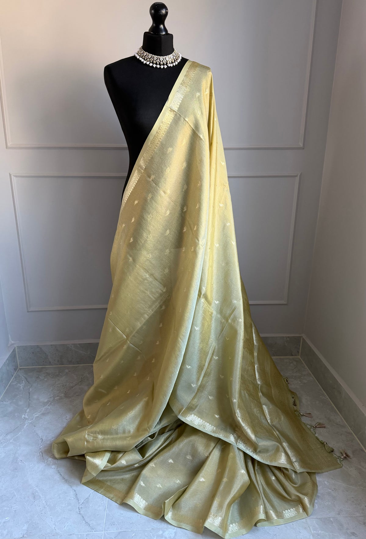 Golden ivory tissue silk saree with slim gold zari border