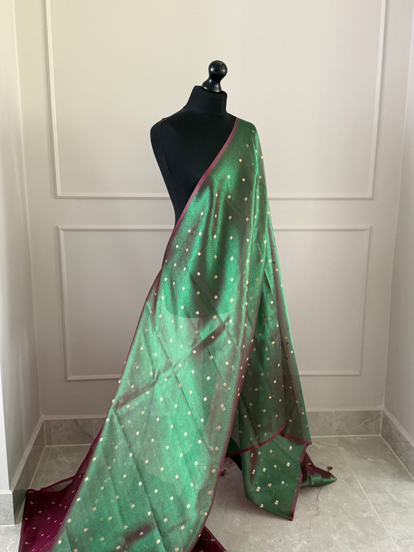 Statement handmade green and magenta dual tone soft tissue saree with unstitched blouse. Gold buti polka dot wedding saree. Unique saree look for events