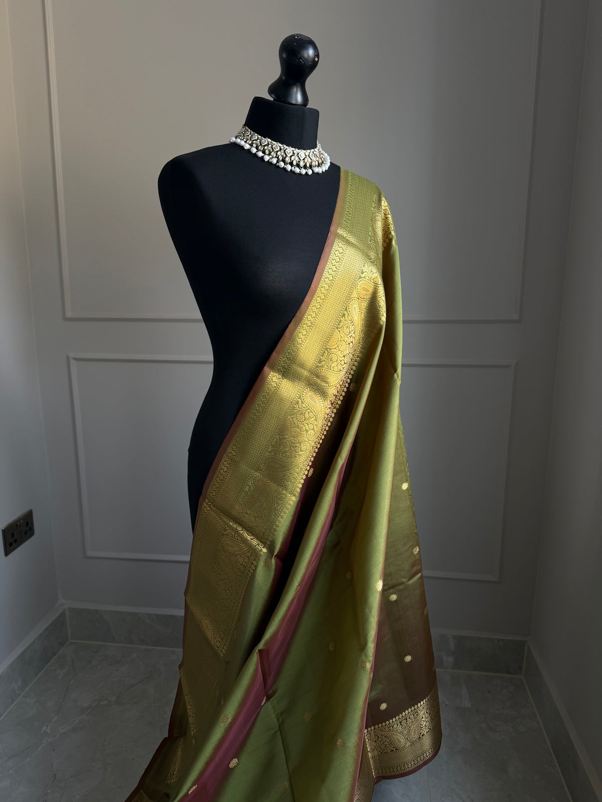 Olive green and maroon hues dual tone silk saree with gold zari border