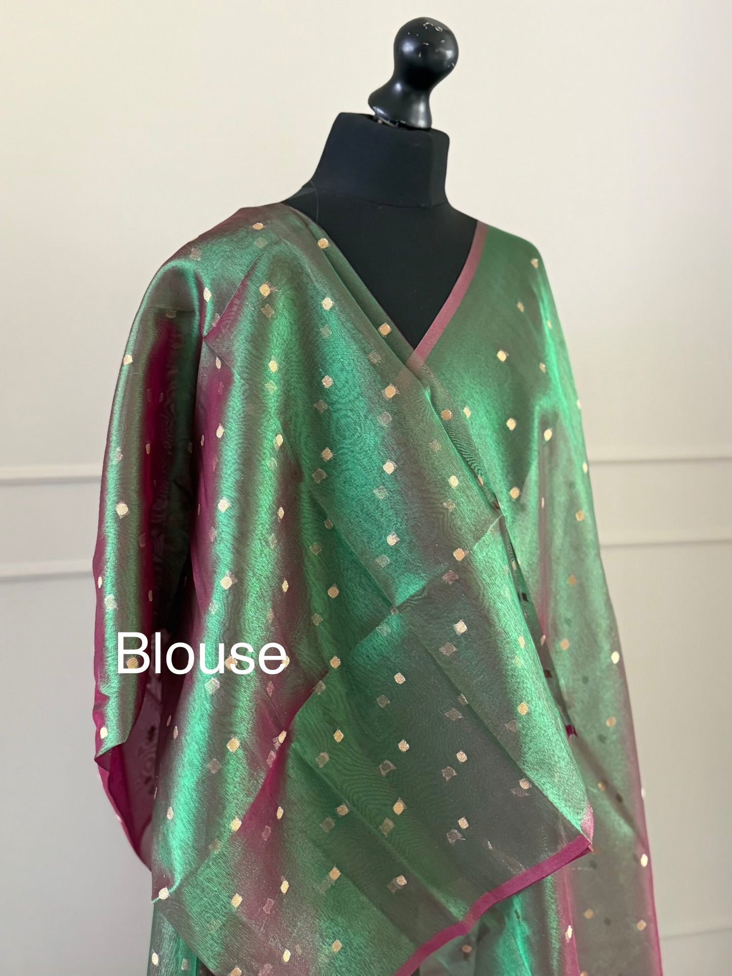 Statement handmade green and magenta dual tone soft tissue saree with unstitched blouse. Gold buti polka dot wedding saree. Unique saree look for events