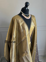 Dual tone tissue silk saree with zari border and brocade blouse