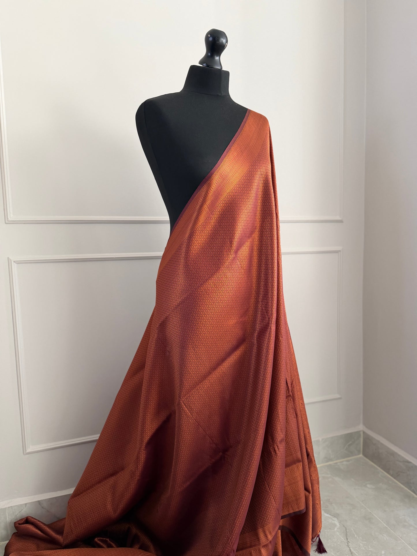 Chocolate brown copper soft silk saree with subtle border and all over sheen. The perfect saree for parties and all traditional events.