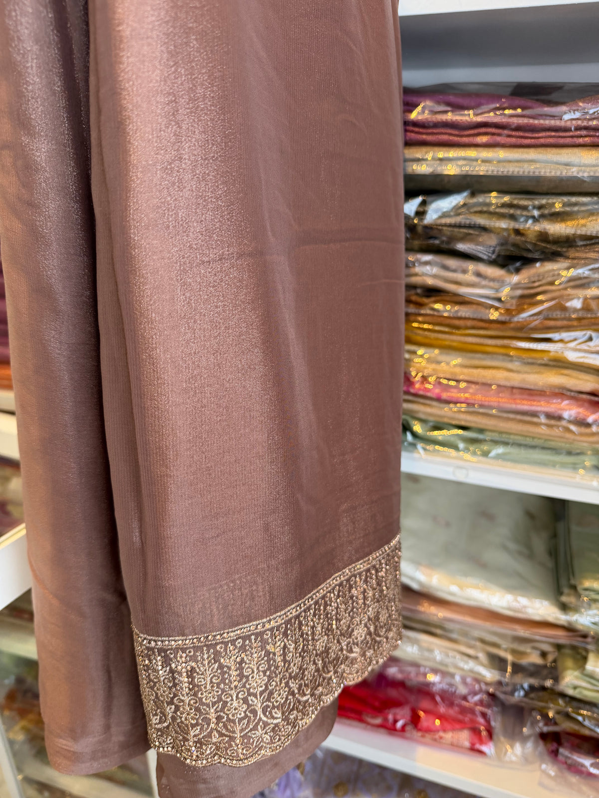 Mocha brown georgette saree with stone work border and pallu