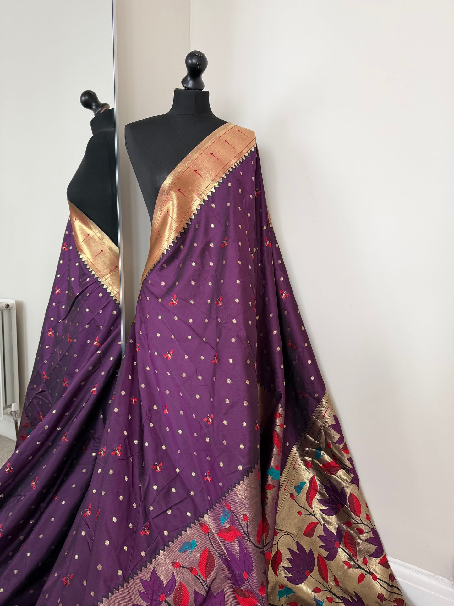 Purple paithani wedding saree. Intricately woven floral design semi silk saree with deep red blouse.