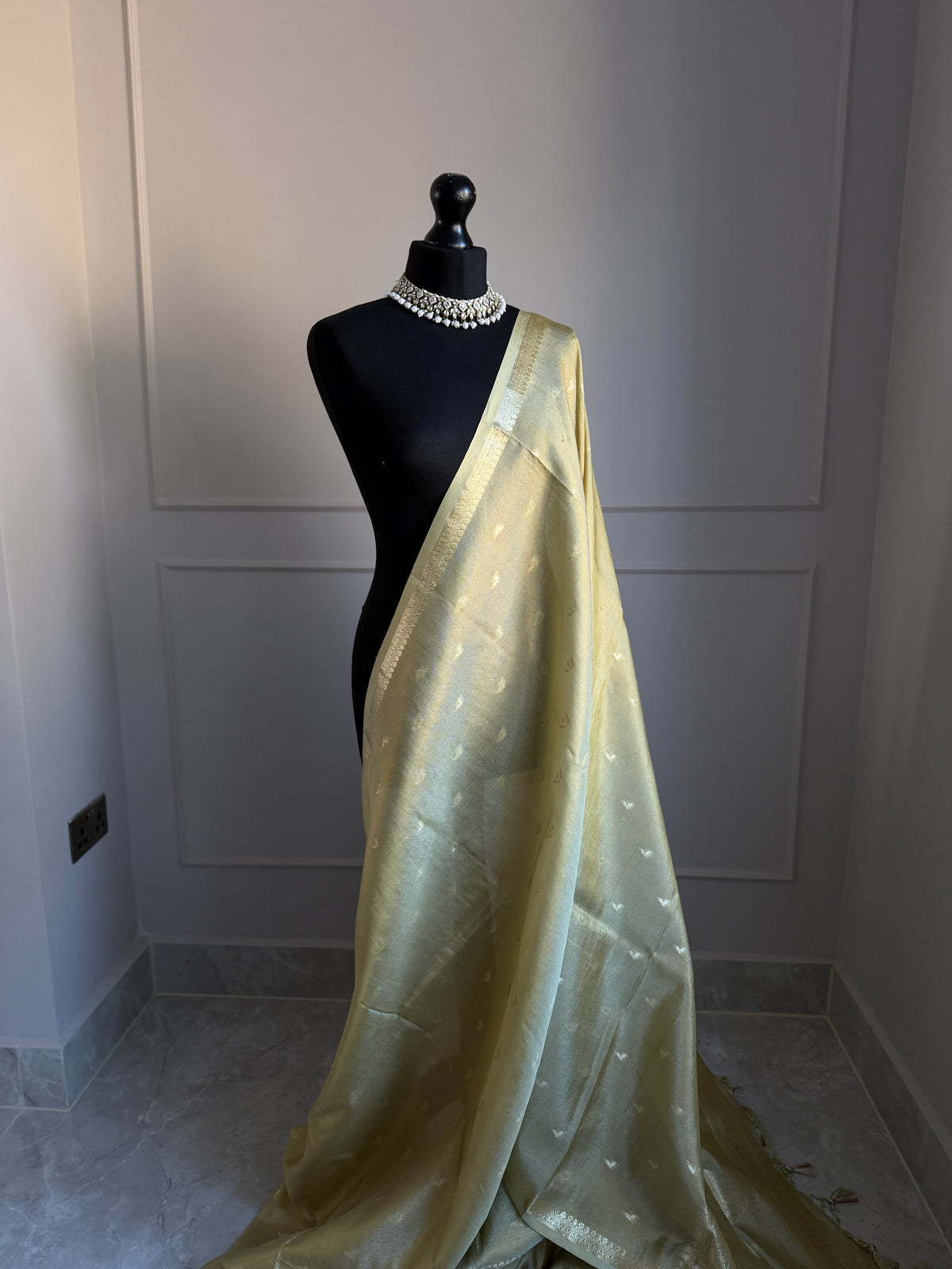Golden ivory tissue silk saree with slim gold zari border