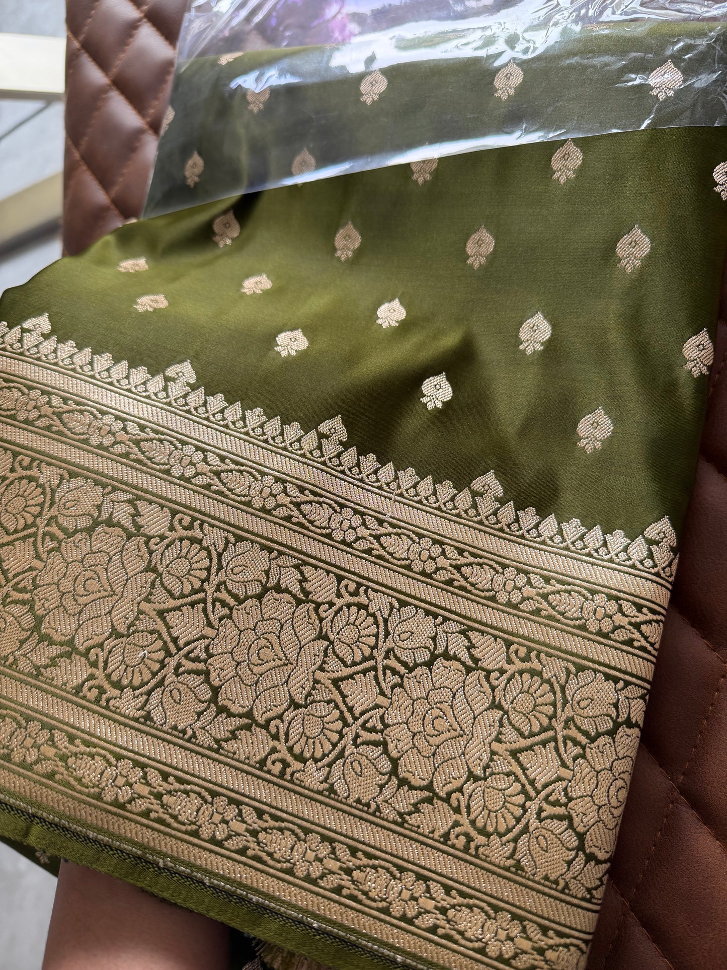 Banarasi silk saree in hues of khaki olive green dark brown with gold Zari.Gold green Saree with plain contrast blouse border for sleeves