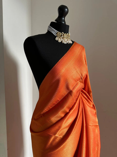 Orange Soft Silk Saree with Copper Border
