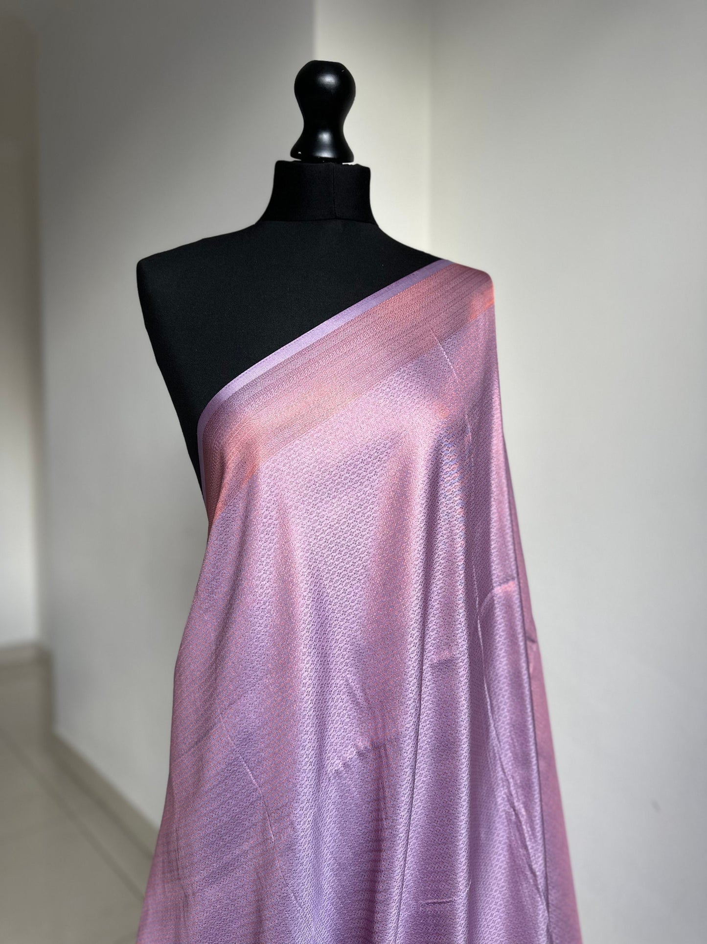 Lilac soft silk saree with a copper border and all over sheen. The perfect saree for parties and all traditional events. Versatile saree