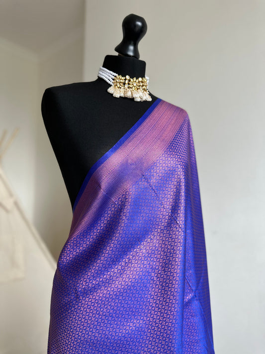 Royal blue soft silk saree with a copper border and all over sheen. The perfect saree for parties and all traditional events.Versatile saree