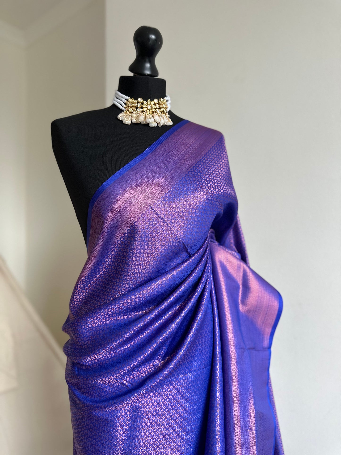 Royal blue soft silk saree with a copper border and all over sheen. The perfect saree for parties and all traditional events.Versatile saree