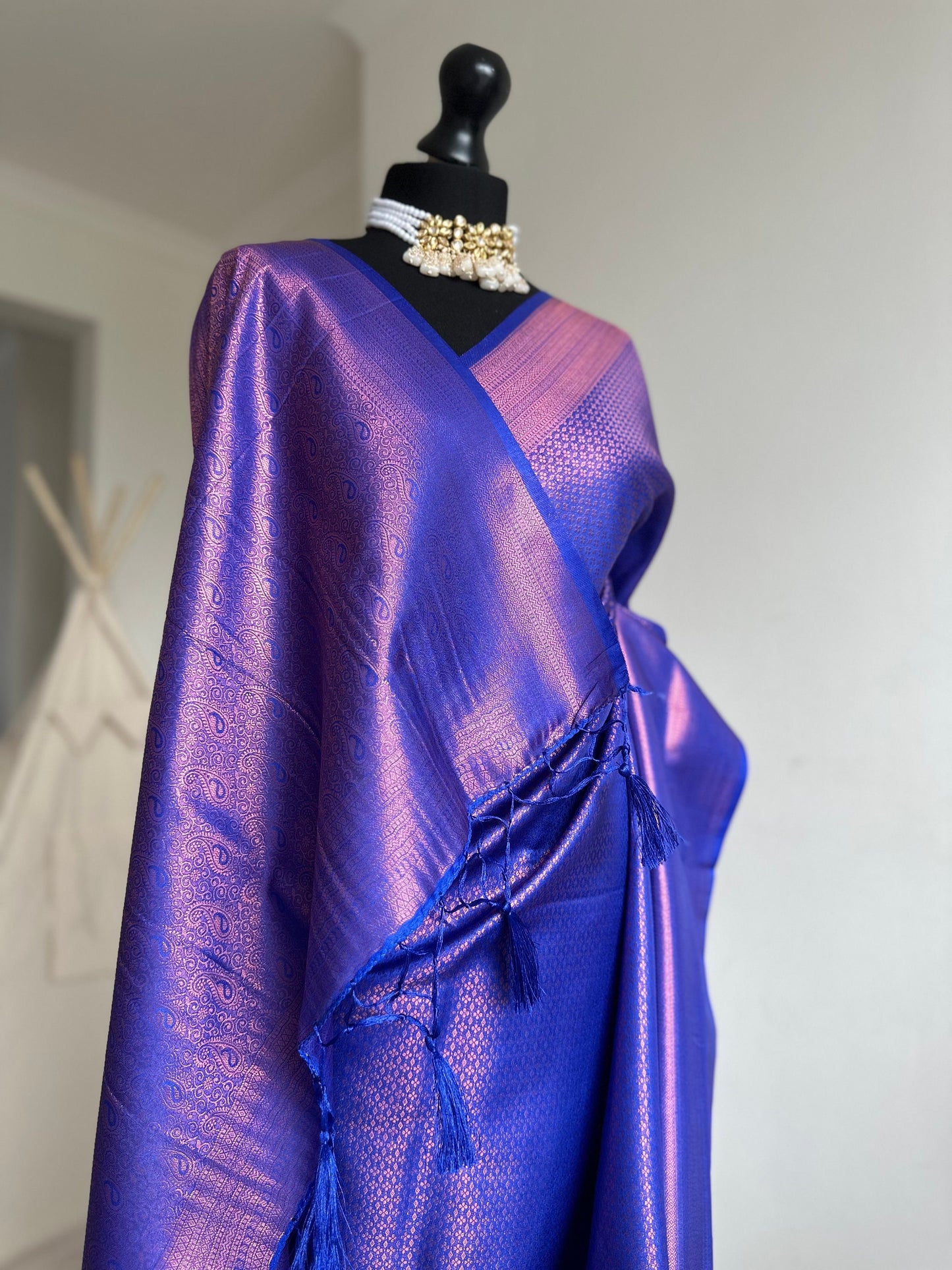 Royal blue soft silk saree with a copper border and all over sheen. The perfect saree for parties and all traditional events.Versatile saree