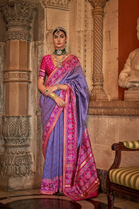 Purple and pink silk patola saree with printed and weaved zari work. Designer saree with blouse for weddings. Designer saree blouse - LaiLai Sarees
