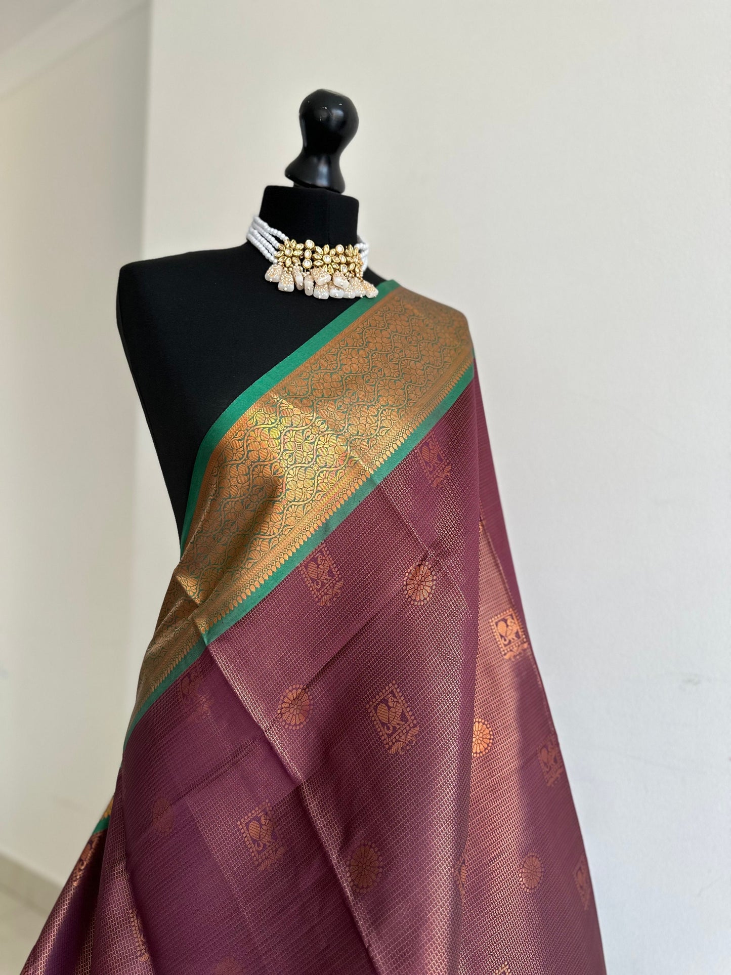 Wine colour saree with green border with copper zari and sheen. Traditional silk saree beautiful colour and design. Designer saree