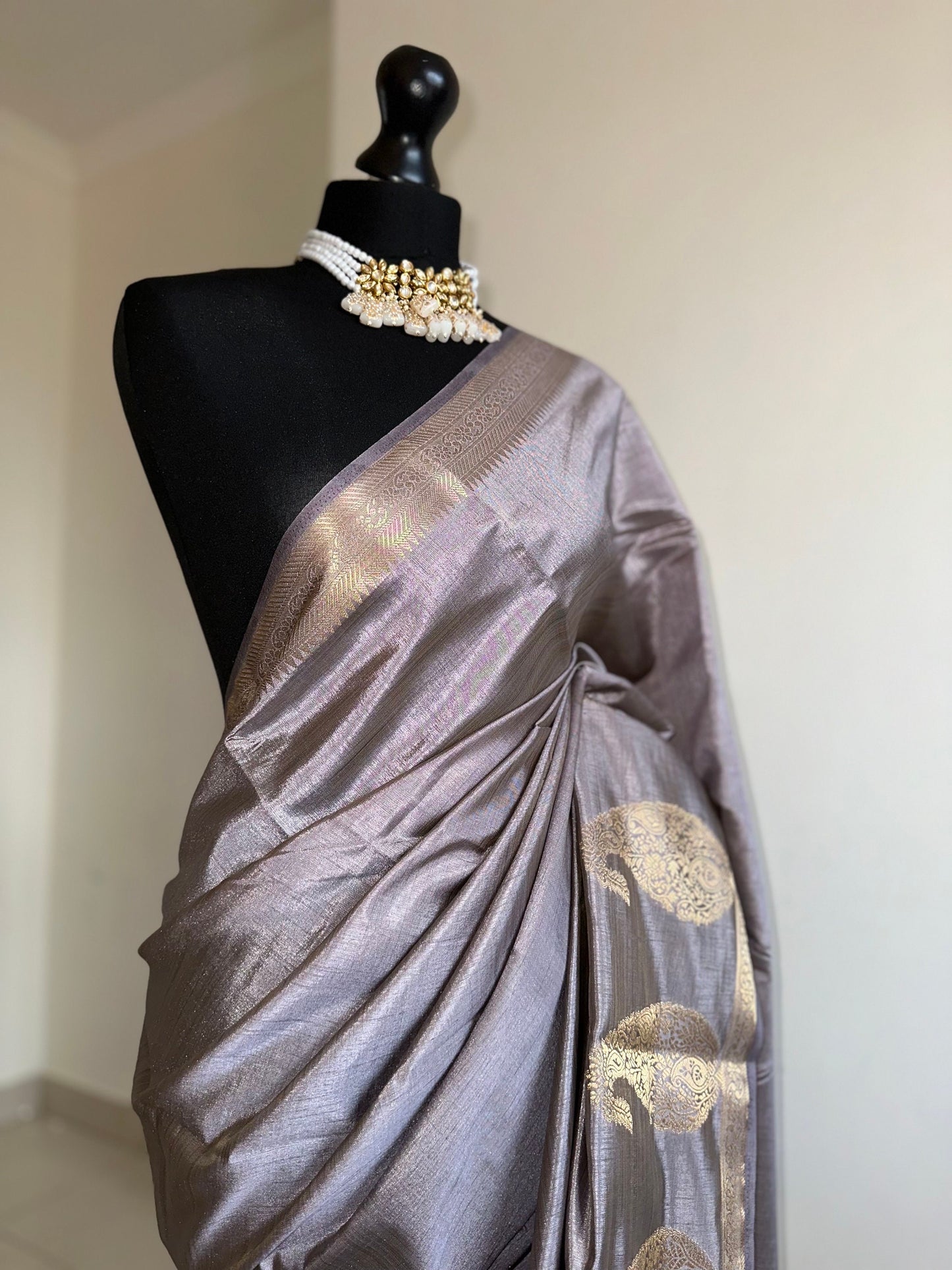 Grey soft tussar raw silk saree with unstitched blouse. Gold work on border and pallu. Statement saree and colour.