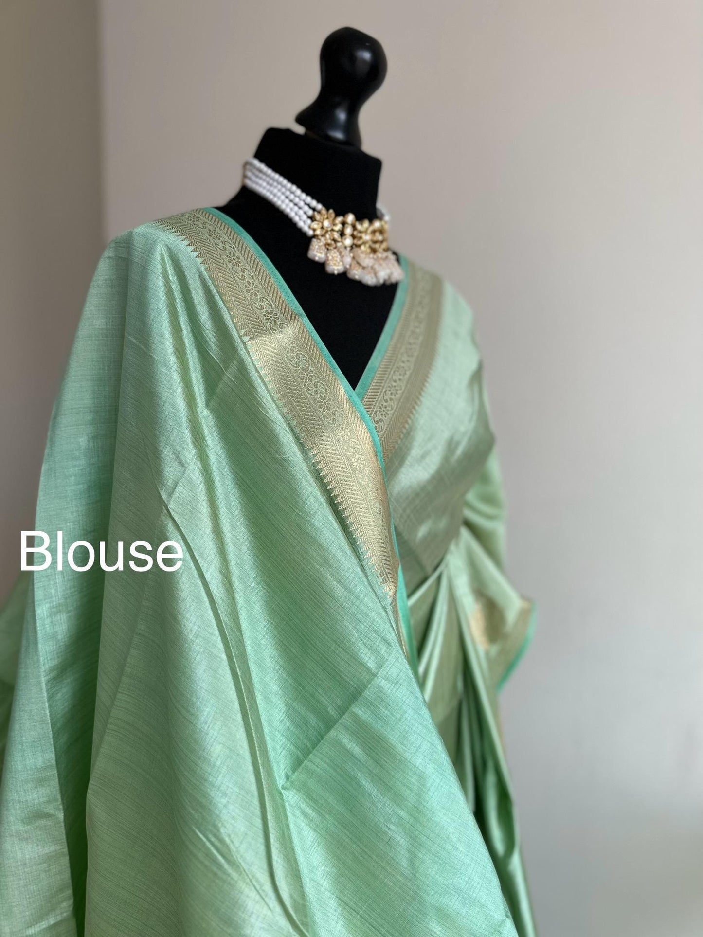 Mint green soft tussar raw silk saree with unstitched blouse. Gold work on border and pallu. Statement saree and colour.