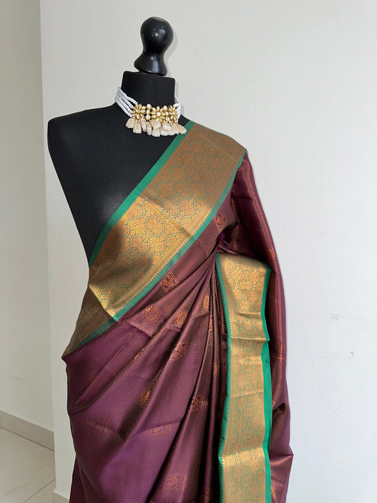 Wine colour saree with green border with copper zari and sheen. Traditional silk saree beautiful colour and design. Designer saree