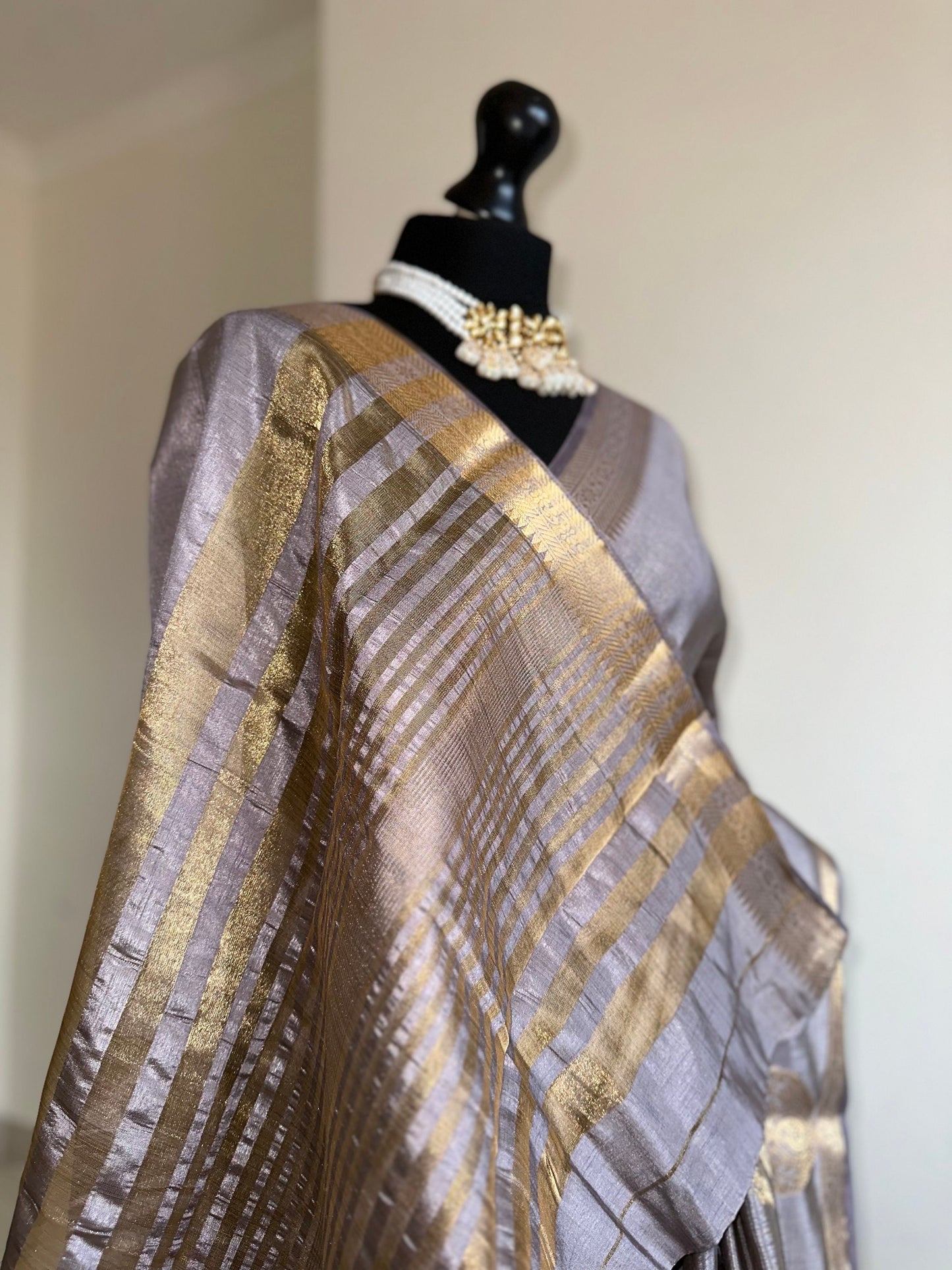 Grey soft tussar raw silk saree with unstitched blouse. Gold work on border and pallu. Statement saree and colour.