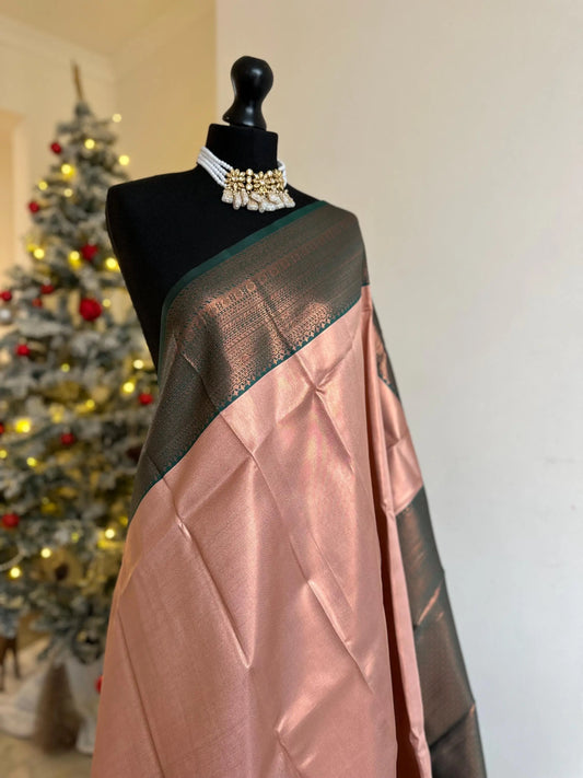 Semi silk peach pink saree with green border and copper motifs. Modern and traditional silk saree beautiful colour and design.Designer saree - LaiLai Sarees