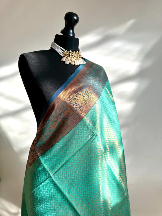 Authentic green saree with navy blue border  copper zari and sheen. Traditional silk saree beautiful colour and design. Designer saree