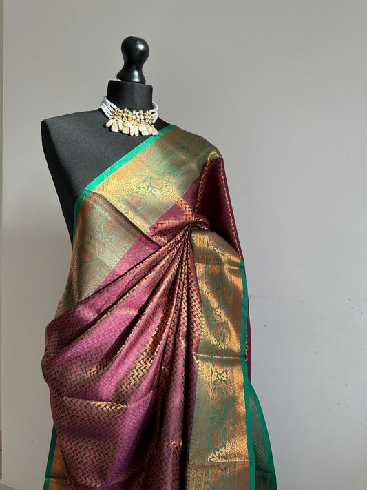 Wine colour saree with green border with copper zari and sheen. Traditional silk saree beautiful colour and design. Designer saree