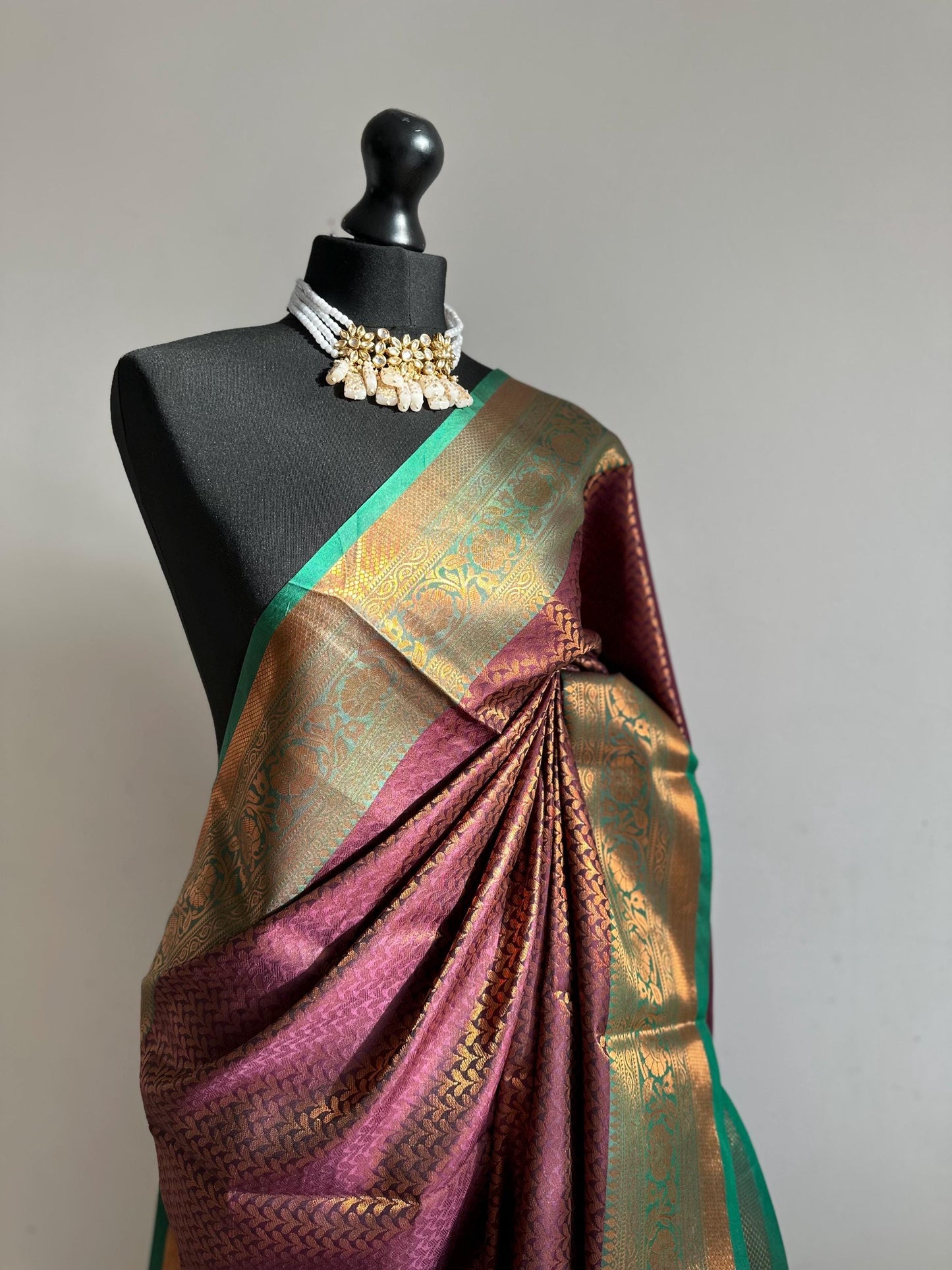 Wine colour saree with green border with copper zari and sheen. Traditional silk saree beautiful colour and design. Designer saree