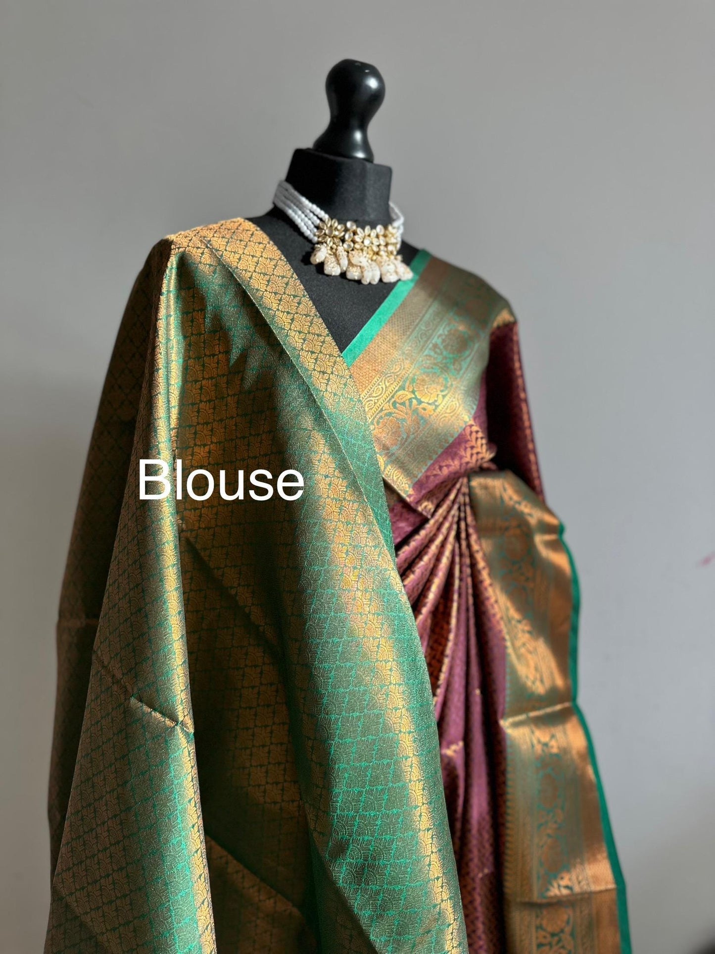 Wine colour saree with green border with copper zari and sheen. Traditional silk saree beautiful colour and design. Designer saree