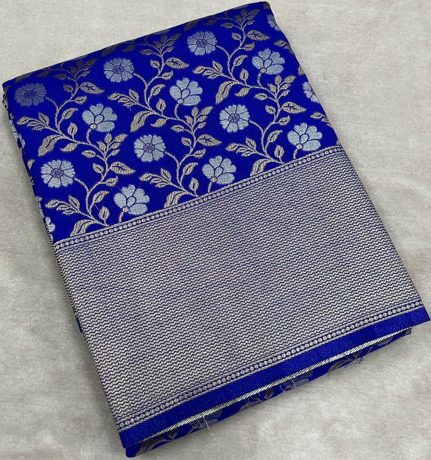 Pure royal blue jaal geogrette designer sare with rich pallu and weaved jaal design and rich silver  gold look with contrast designer blouse