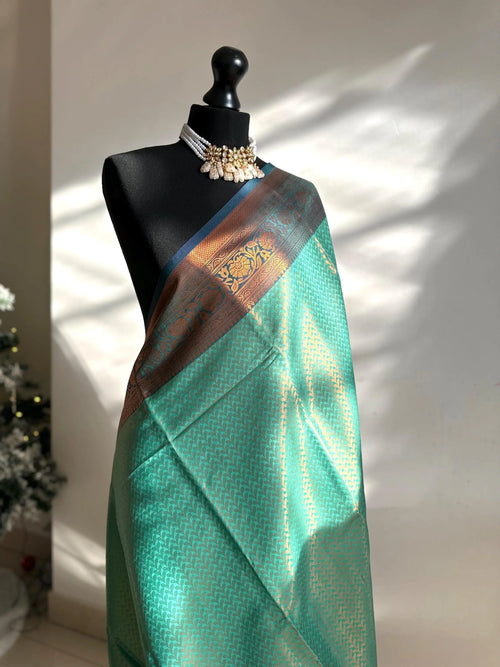 Authentic green saree with navy blue border  copper zari and sheen. Traditional silk saree beautiful colour and design. Designer saree