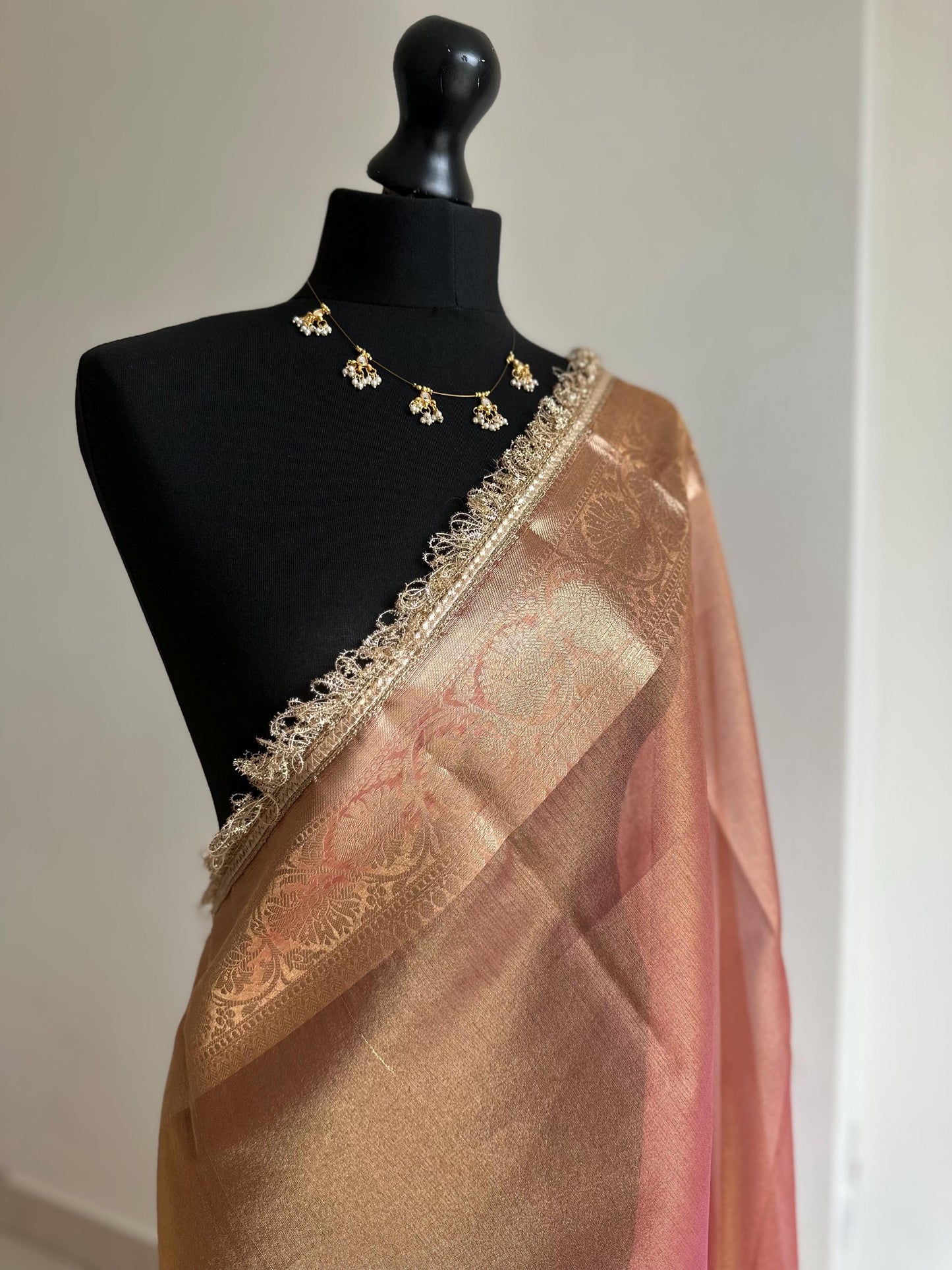 Pink and gold dual toned plain shimmer soft tissue saree with border and unstitched blouse. Elegant wedding guest saree unique saree look