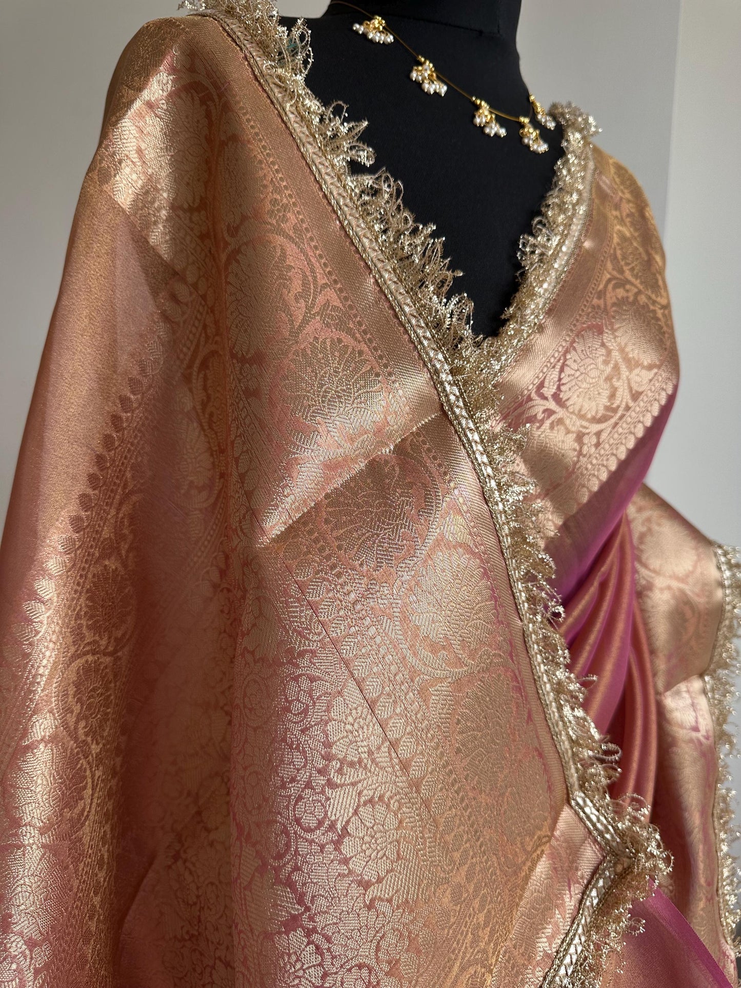 Pink and gold dual toned plain shimmer soft tissue saree with border and unstitched blouse. Elegant wedding guest saree unique saree look