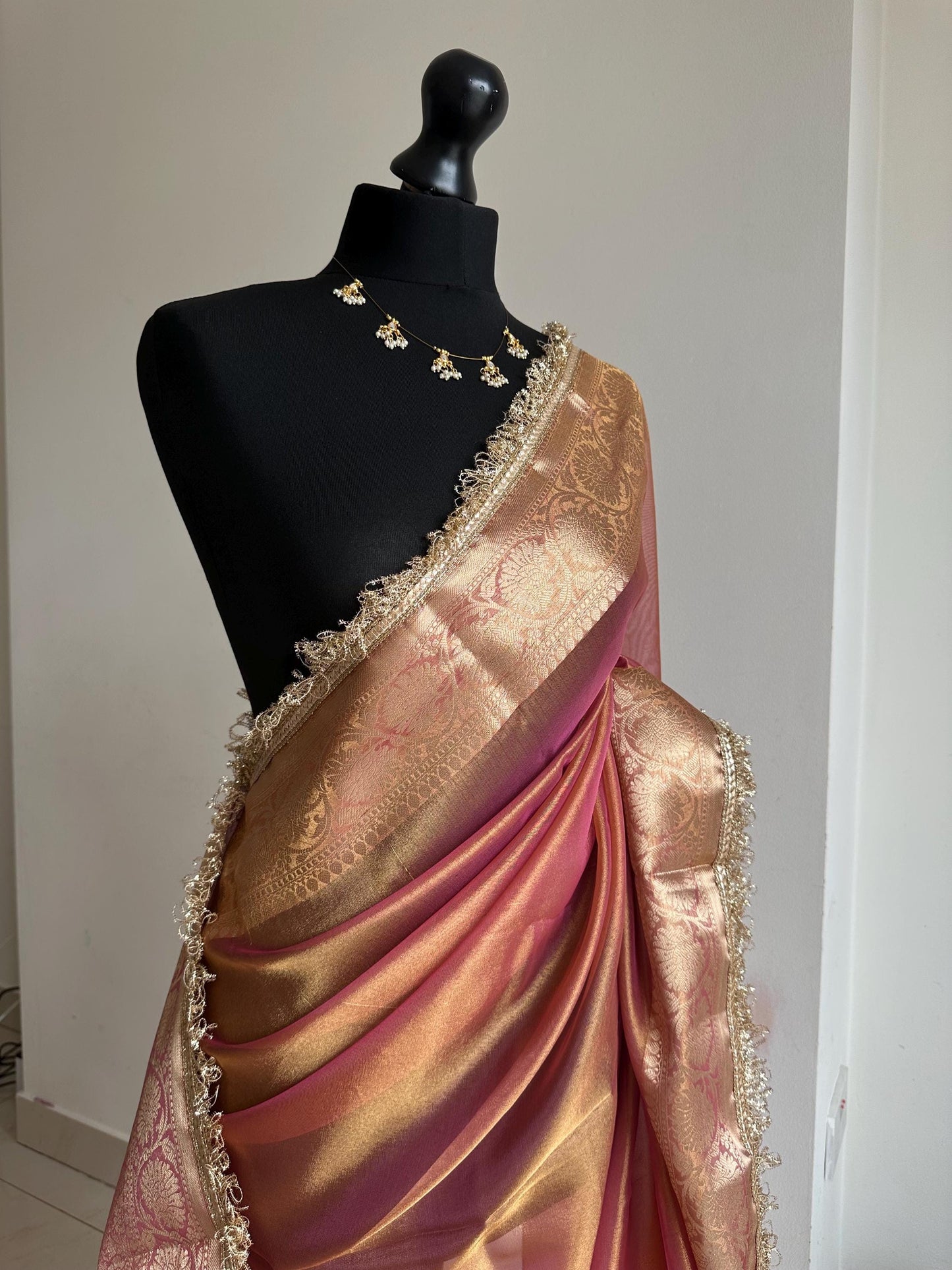 Pink and gold dual toned plain shimmer soft tissue saree with border and unstitched blouse. Elegant wedding guest saree unique saree look