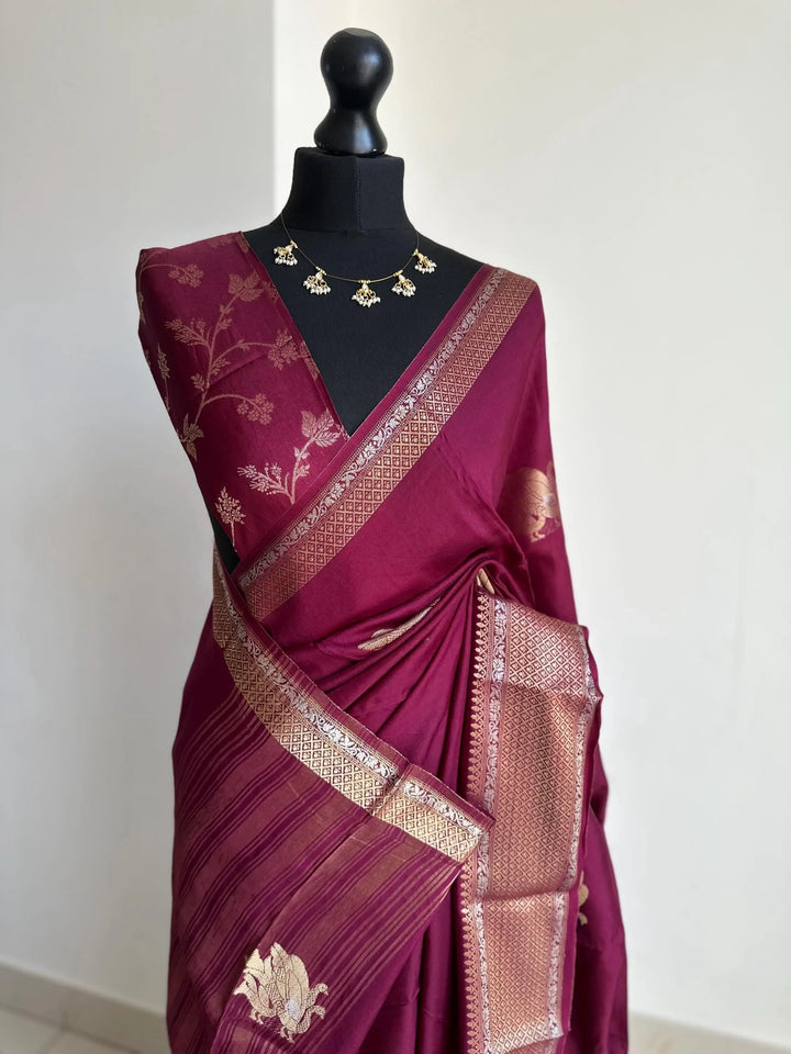 Wine colour semi silk saree with subtle gold and silver zari border and peacock motifs. Floral jaal blouse. Partwear traditional saree LaiLai Sarees