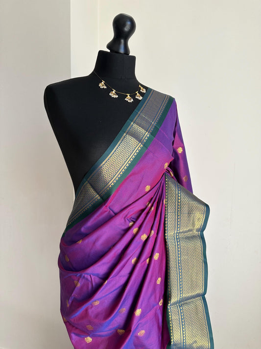 Purple and green semi silk saree with gold zari border and buti. Traditional designer saree beautiful colour and design.