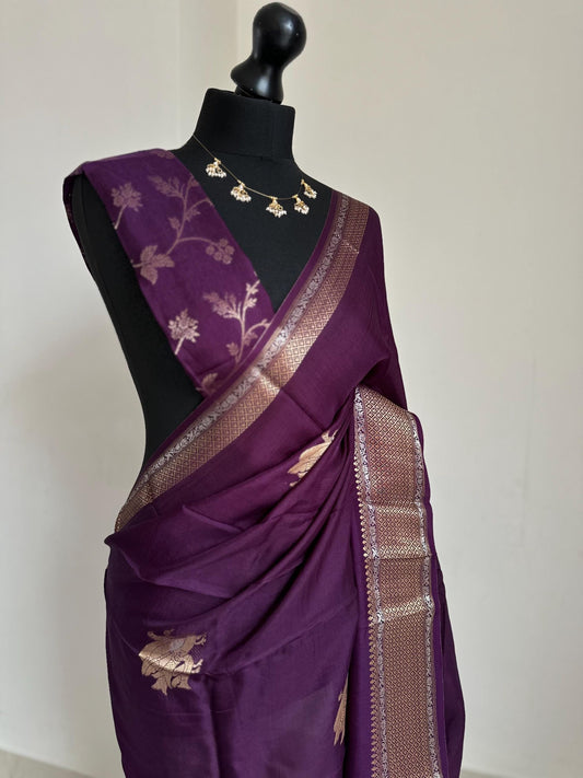 Purple semi silk saree with subtle gold and silver zari border and peacock motifs. Floral jaal blouse. Partwear traditional saree