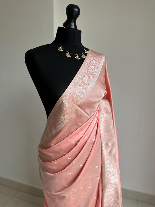 Banarasi silk pastel peach wedding saree with gold Zari. Champagne gold zari on traditional saree with plain contrast unstitched blouse