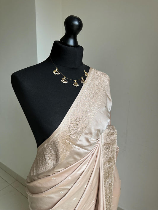 Banarasi silk beige blush wedding saree with champagne gold Zari. Champagne gold zari on traditional saree with plain contrast blouse